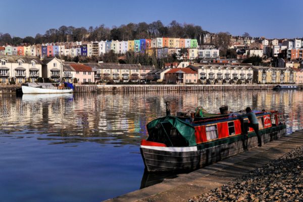 A barge sitting on the waterfront in Bristol.
