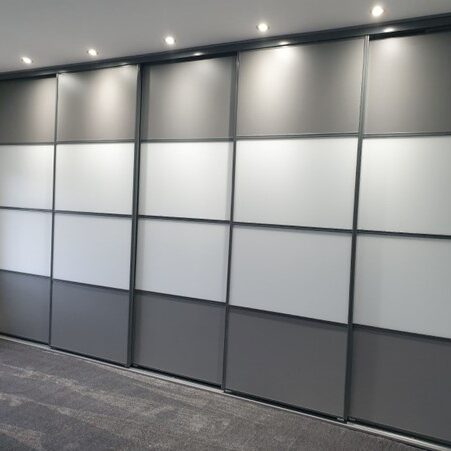 Wide sliding wardrobe doors providing easy access and a seamless fitted wardrobe design.