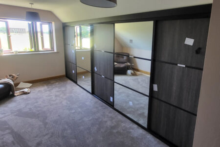 Black framed doors in mirror & grey oak