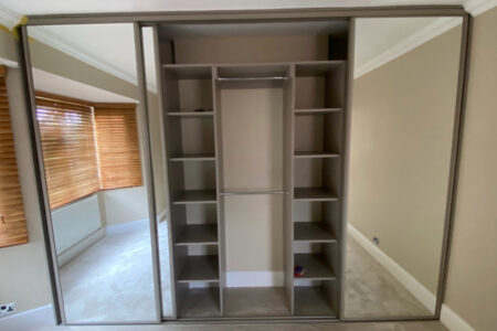 Sliding wardrobe, mirrored and open