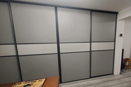 Grey wardrobe, closed with white stripe