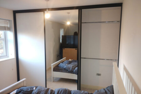 Taller mirrored wardrobe in cream room, right side open